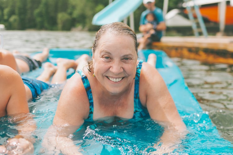 a-happy-senior-woman-having-fun-in-the-lake
