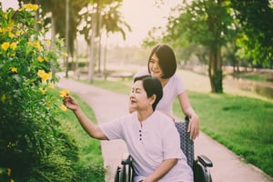 caregiver-take-care-to-elderly-asian-woman-sitting-on-wheelchair-senior-care-insurance-concept_t20_2WAWkJ