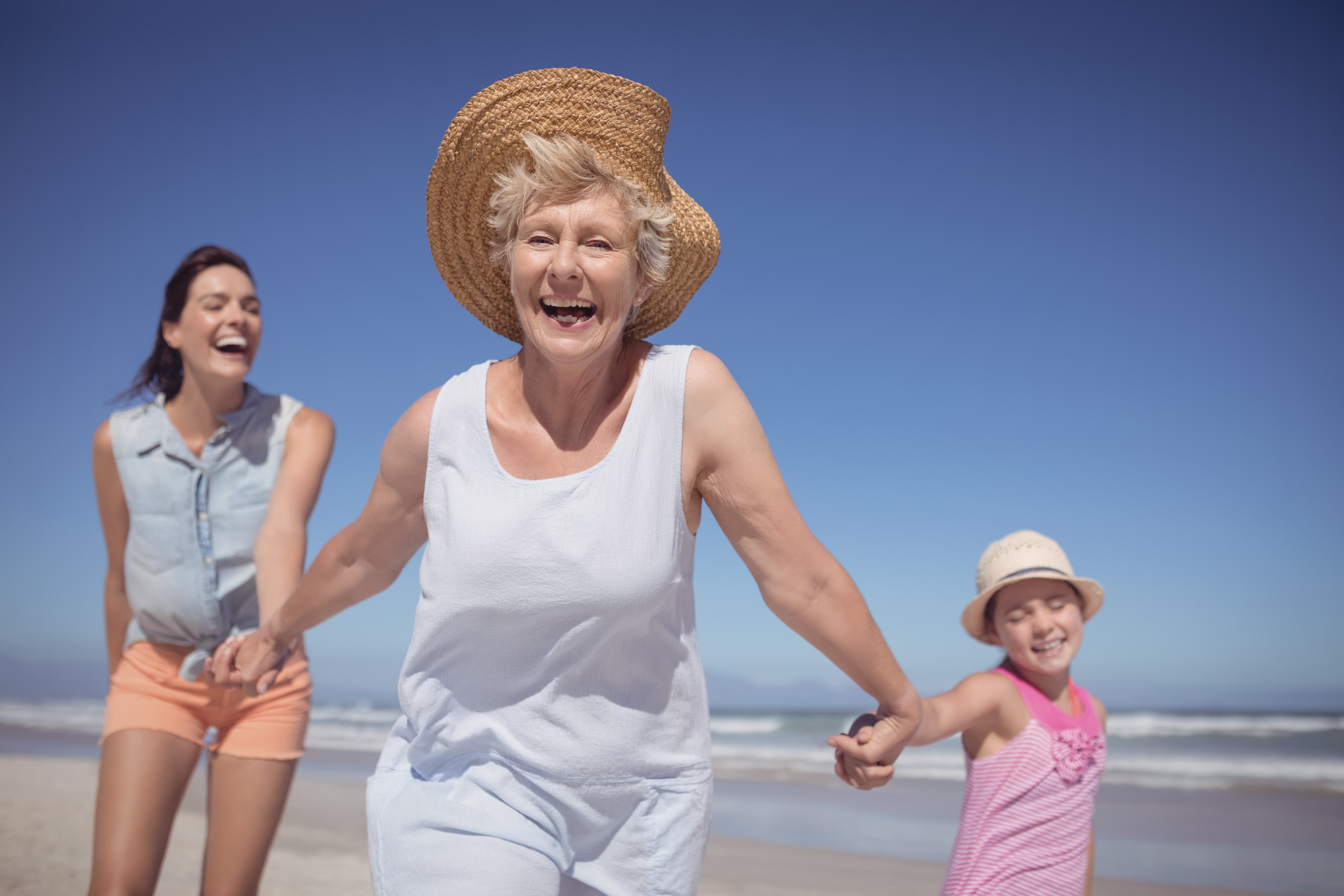 cheerful-multi-generation-family-at-beach