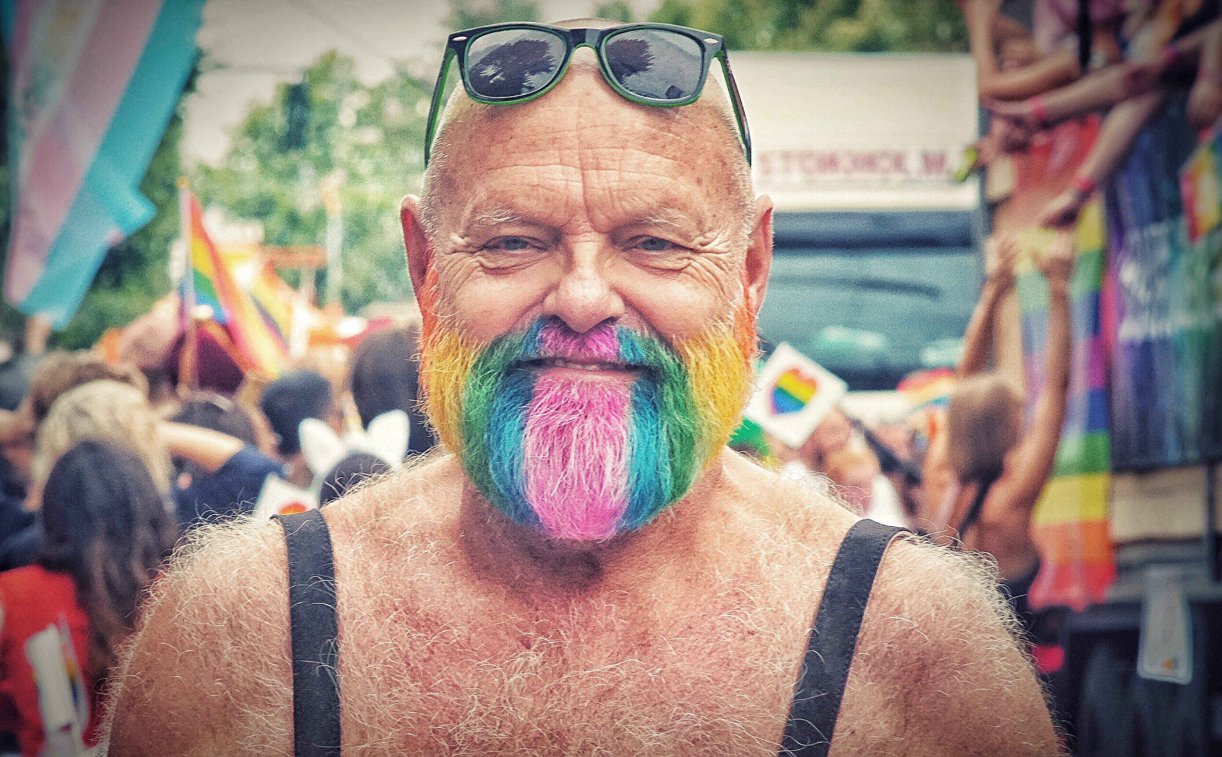 older-man-with-rainbow-beard-at-pride-parade