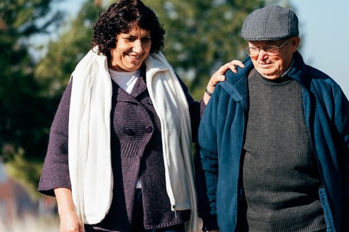 senior-couple-walking-caregivers taking care of themselves