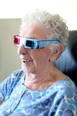 senior-woman-laughing-with-3d-glasses-on