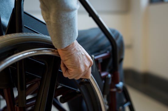 senior-hand-on-wheelchair